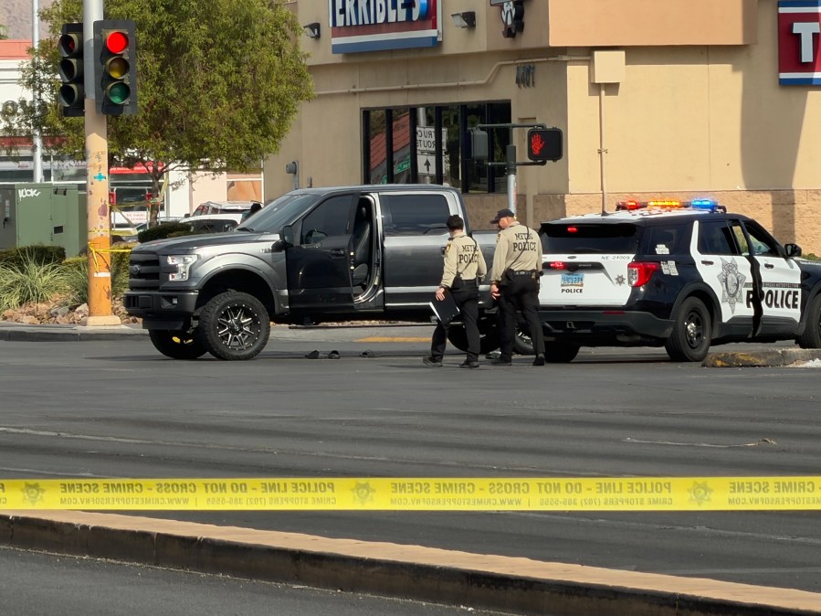 Bystander killed by stray bullet while in car at intersection; police detain 1 person