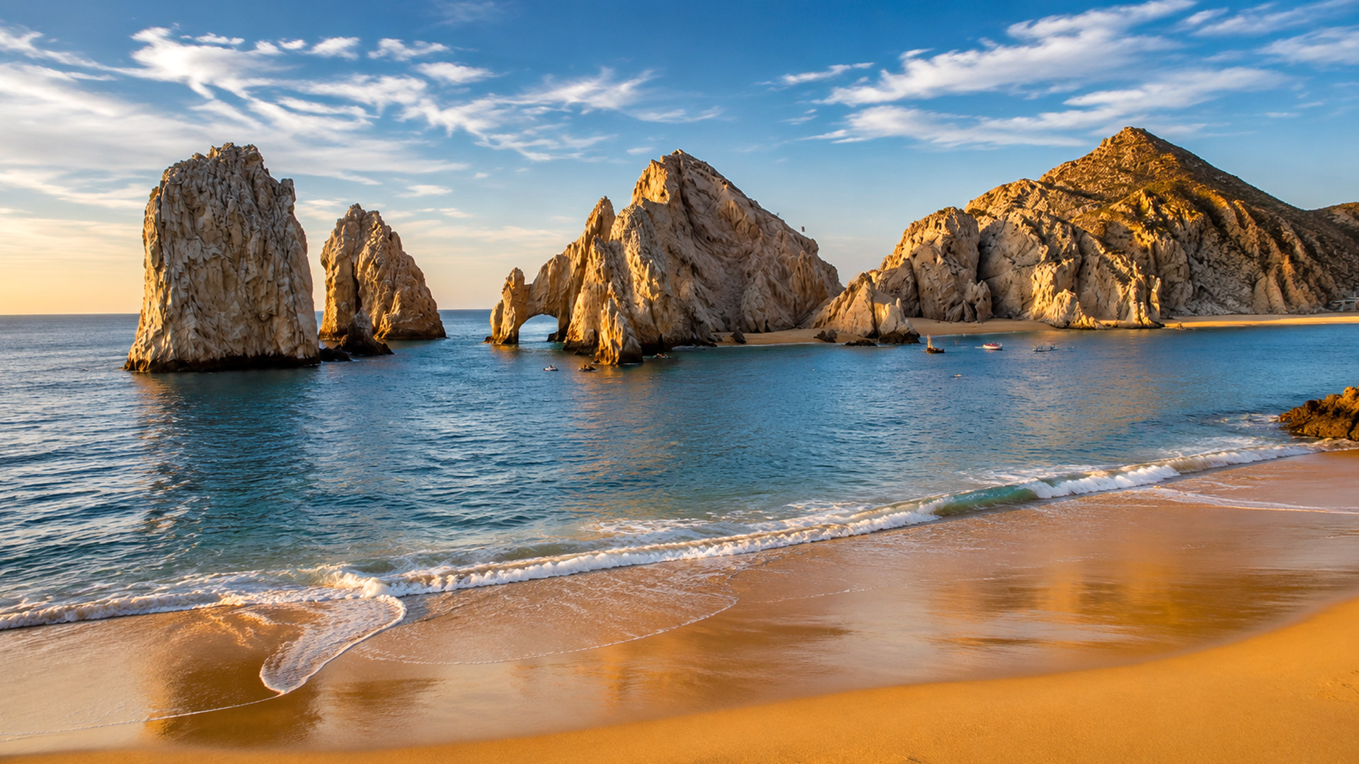 Lovers Beach framed by cliffs and sea stacks