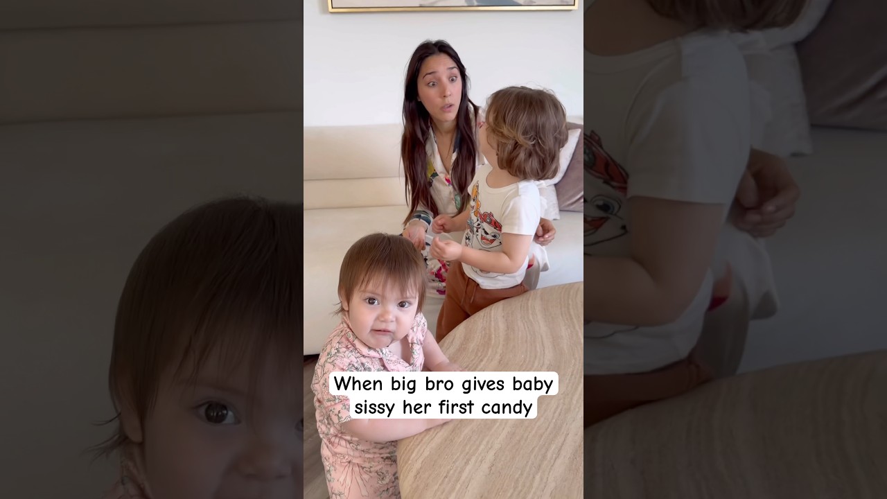 Older brother surprises baby sister with first candy