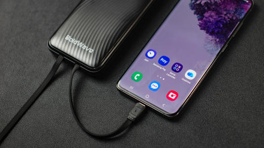 A power bank connected to a smartphone
