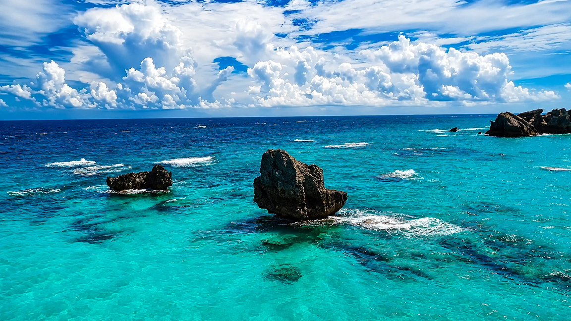 Crystal-clear waters surrounding Bermuda’s rocky coast