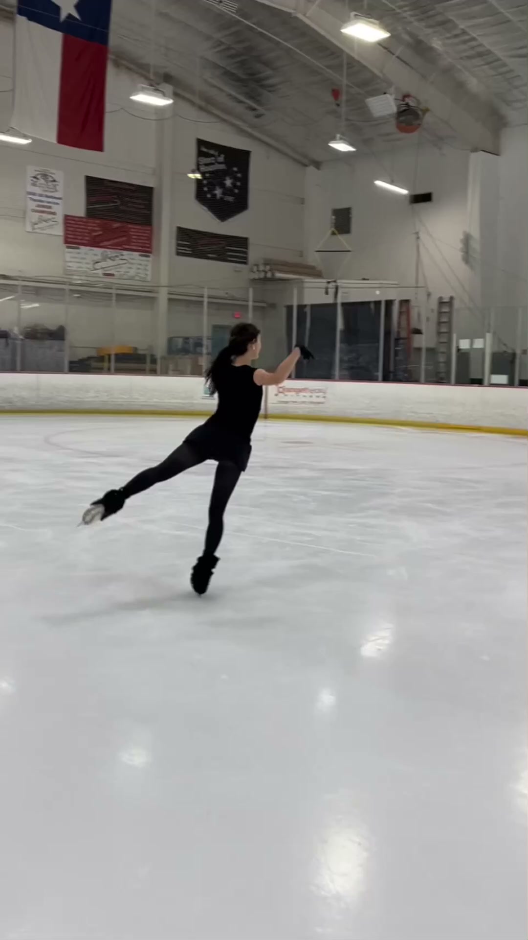 Figure skater performs a flying sit spin with impressive precision