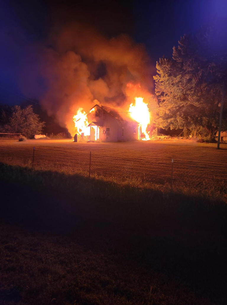 Firefighters battle house fire in Kingman