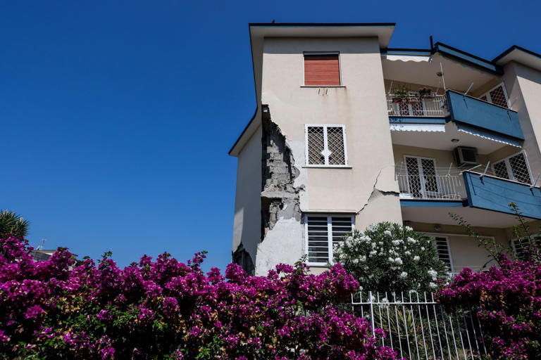 Falling rocks smash cars after earthquake rocks major Italian city