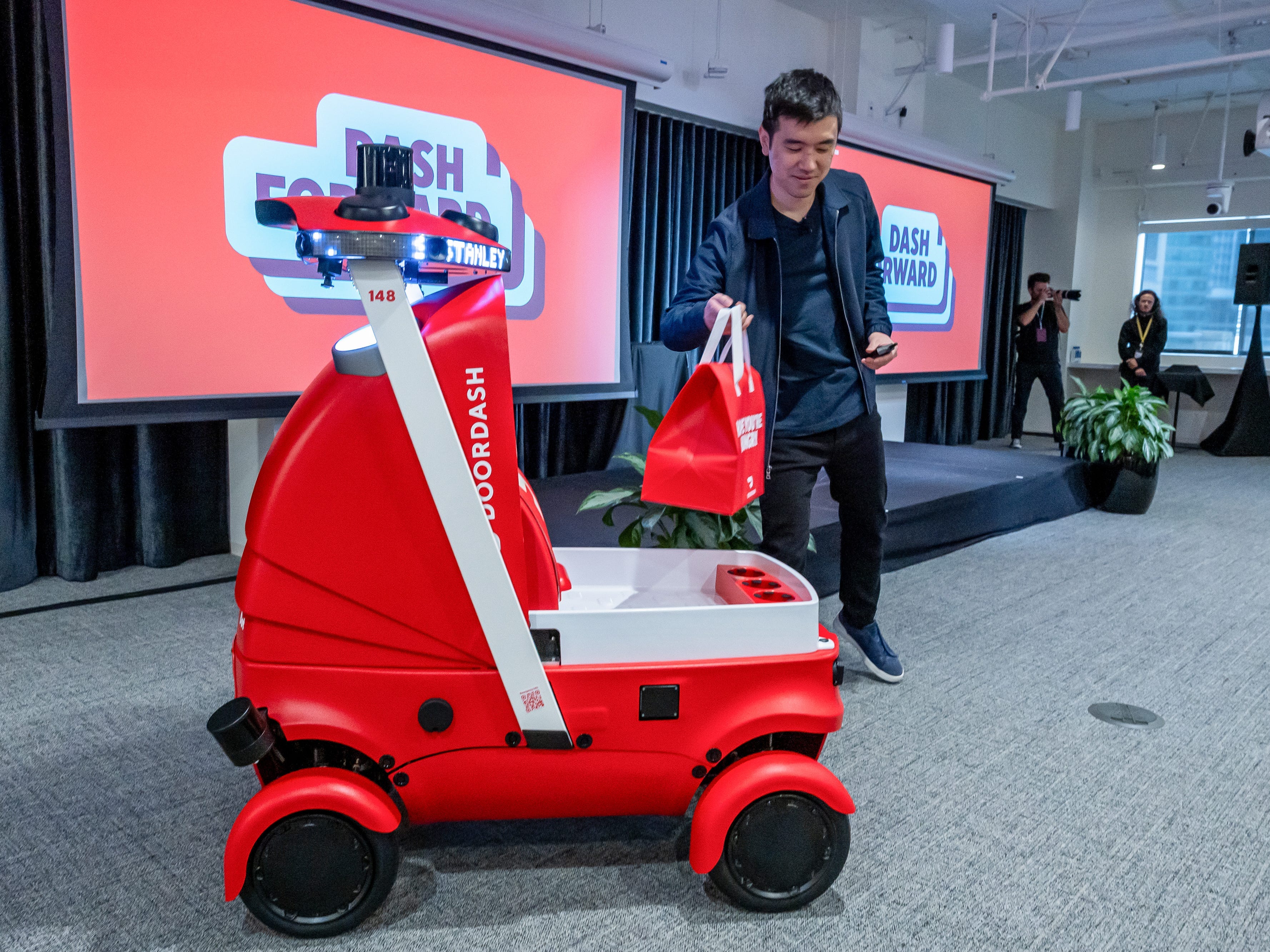 DoorDash is paying people to load its delivery robots. It points to a ...