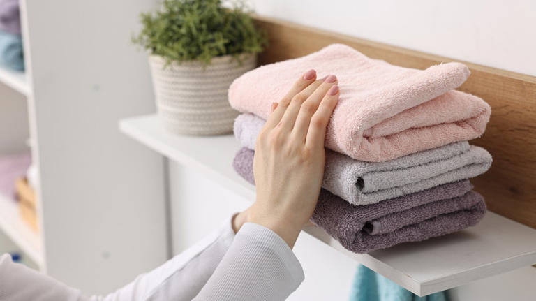 Woman finds a cuter way to hang bathroom towels with a chic DIY