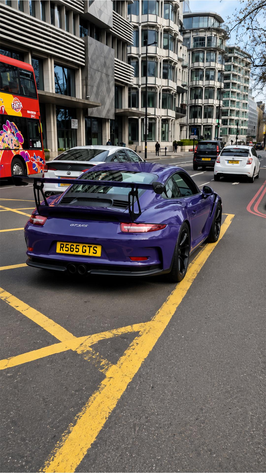 The purple Porsche everyone watches pass by