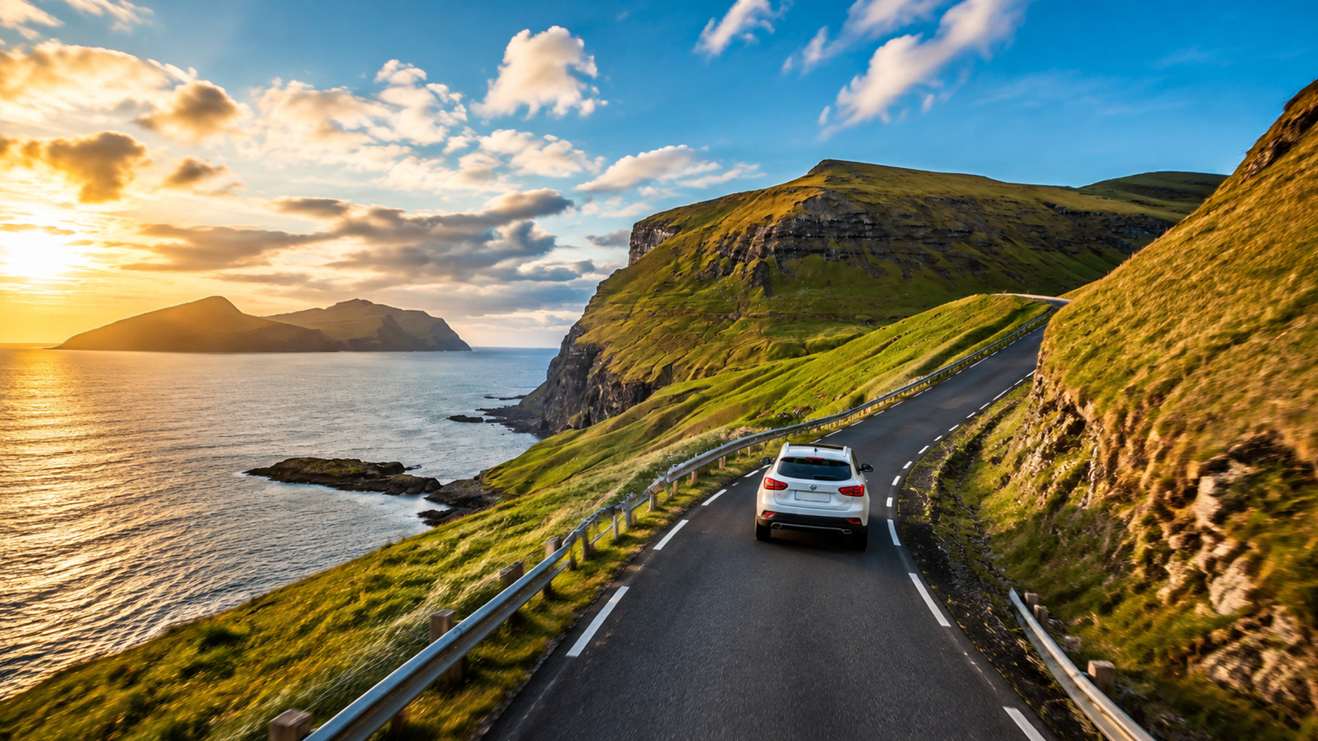 A coastal road winding through the Faroe Islands cliffs