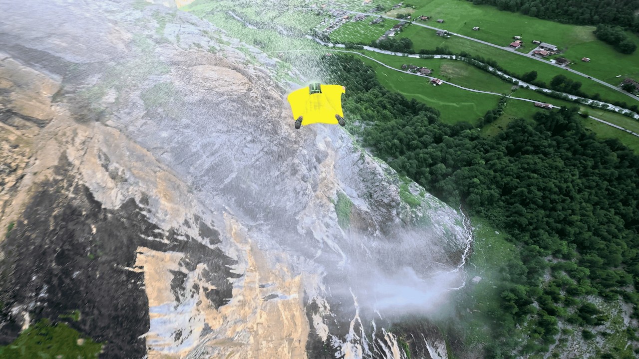 Watch this man fly through a waterfall - 
