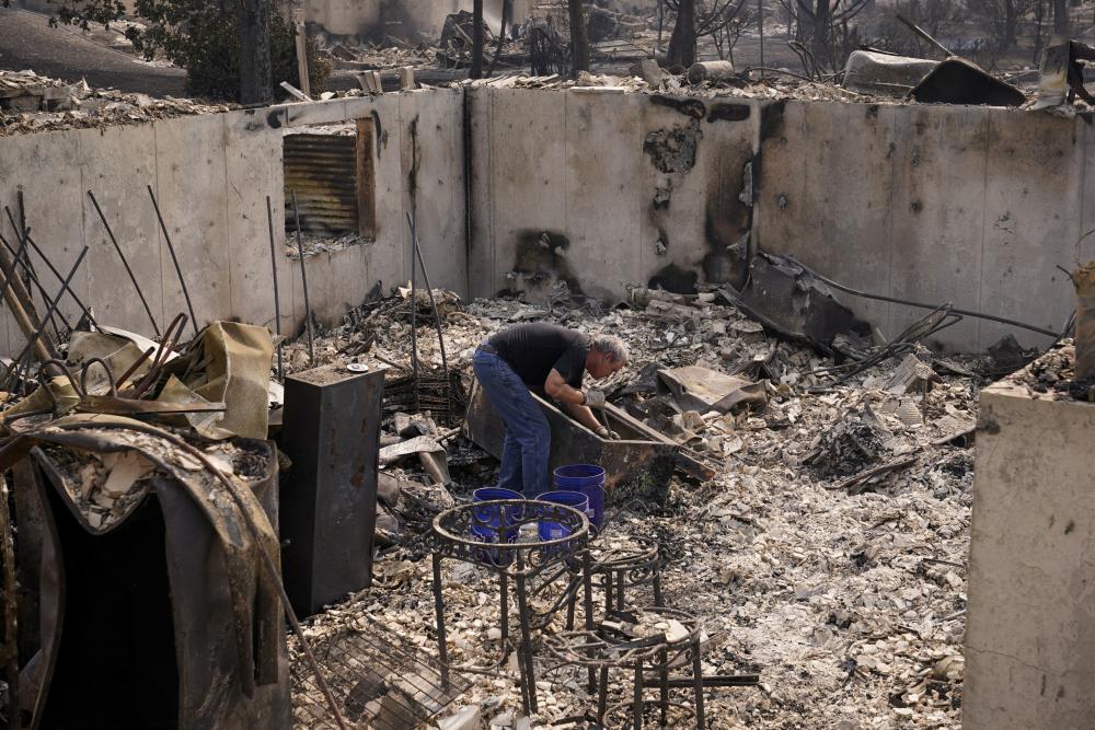 Raging Washington state wildfires destroy homes and force 60,000 people to evacuate