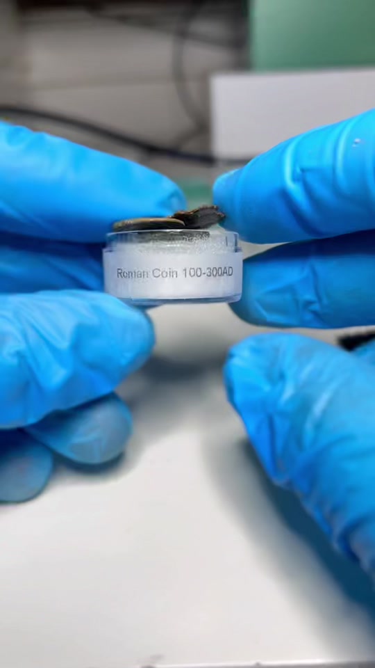 Ancient Roman coins under microscope