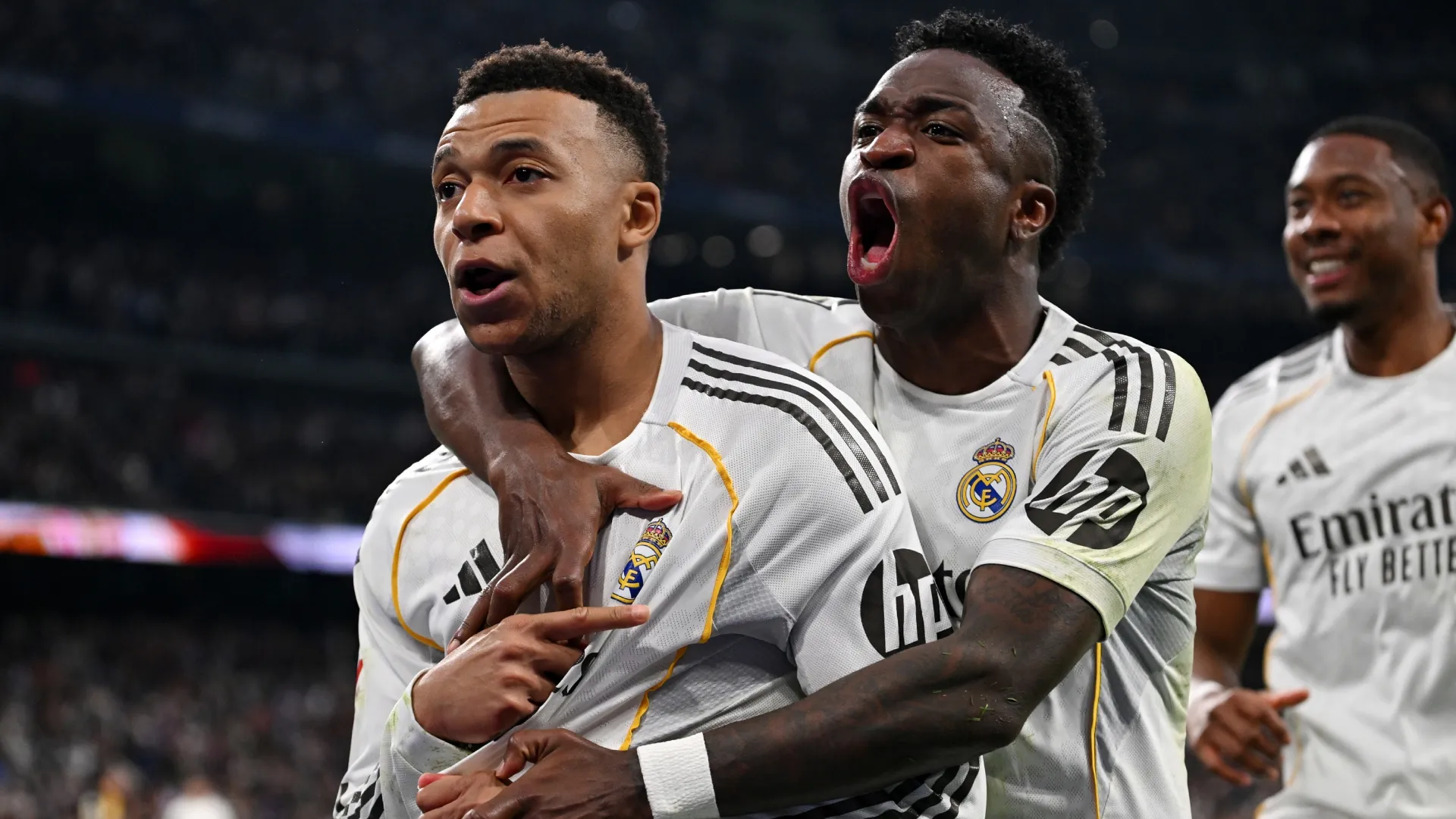 Kylian Mbappe of Real Madrid celebrates scoring with teammate Vinicius Junior. (Denis Doyle/Getty Images)