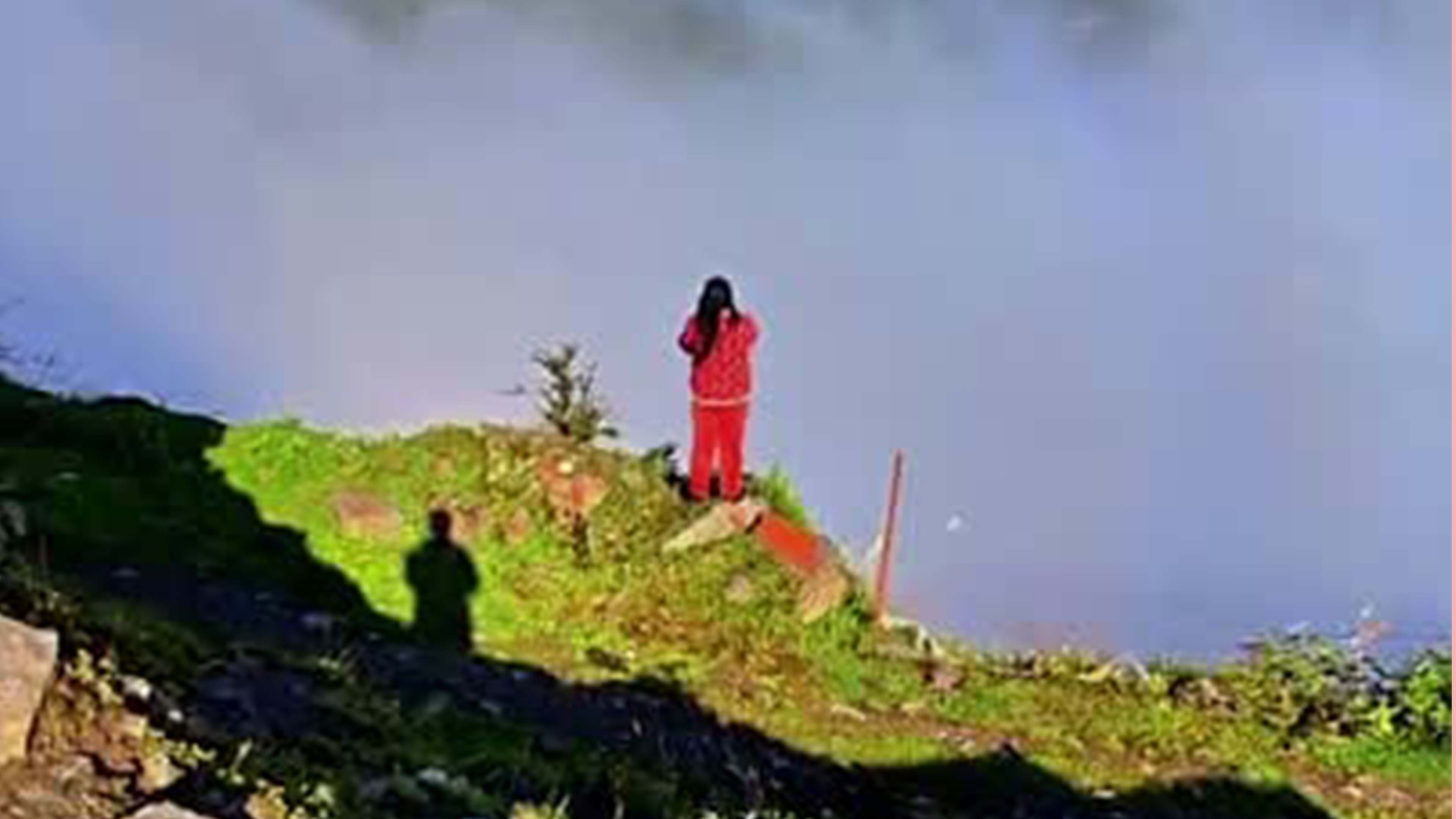 Buddha's light creates halo around hiker's shadow