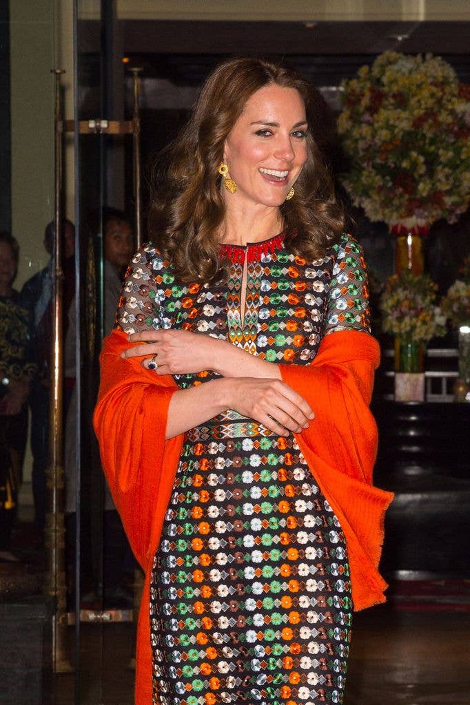 A burnt orange shawl was draped across her shoulders