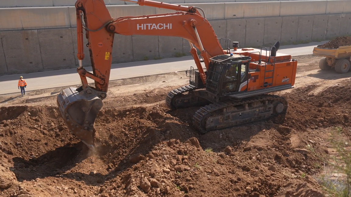 Massive hydraulic excavator performing heavy earthmoving operations