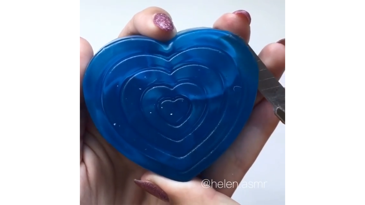 Satisfying heart shaped blue soap carving creating smooth concentric layers