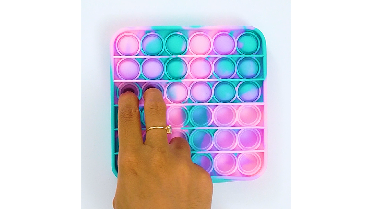 Enjoying a pastel swirl pop it with calming bubble patterns