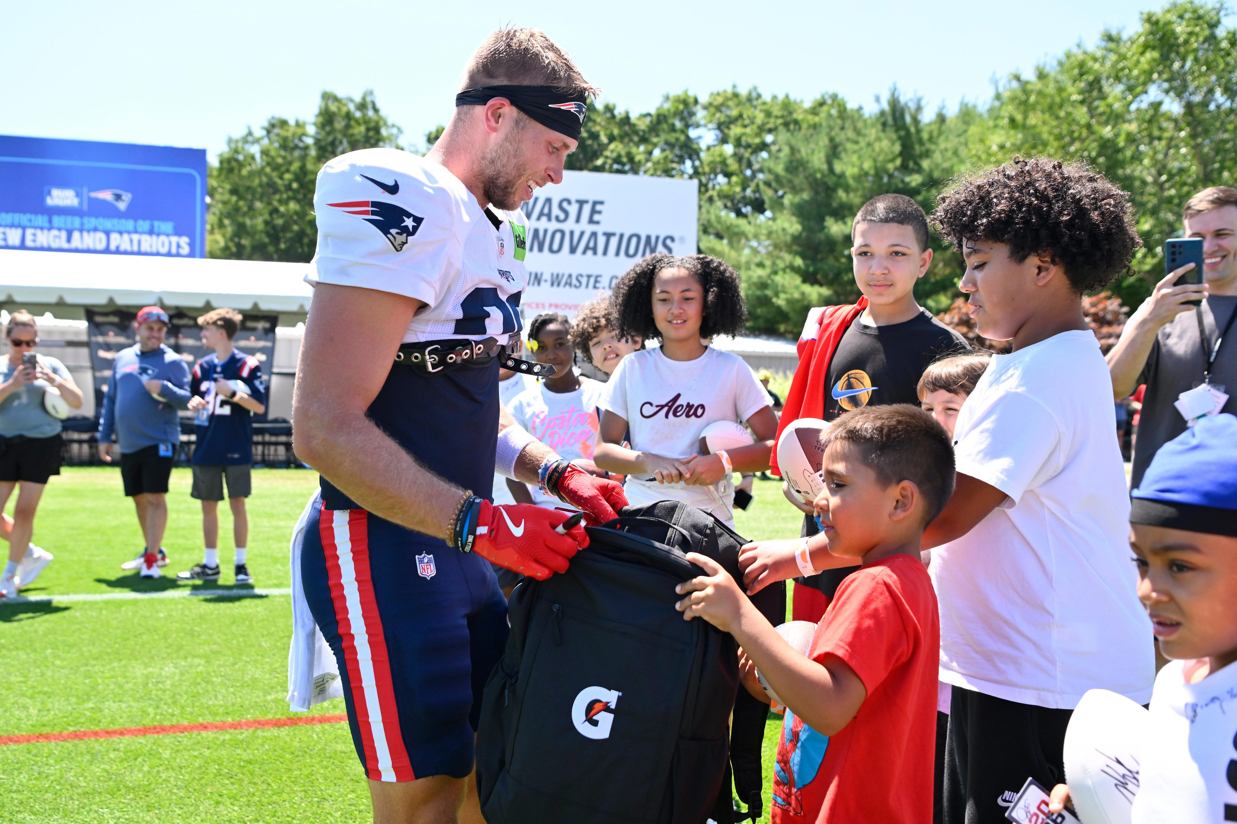 Patriots players surprise Woonsocket youths with school gear