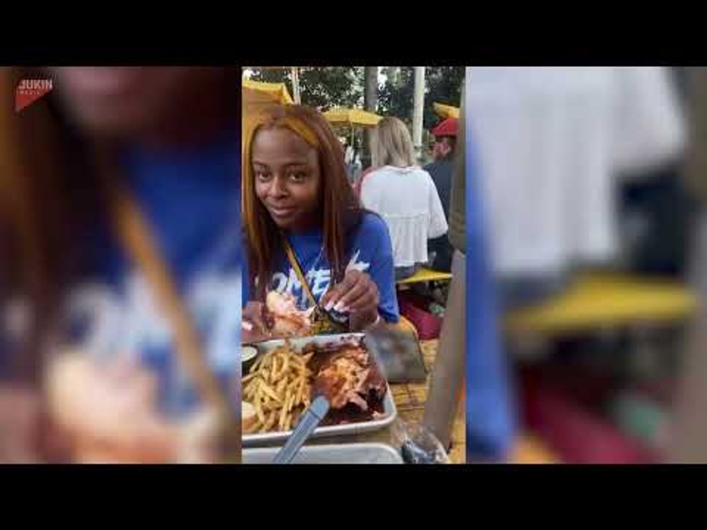 Dog stares at woman eating food