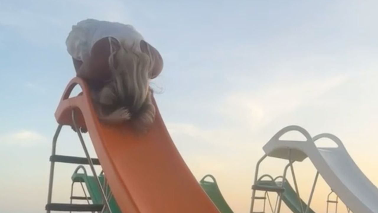 Beach slide mishap sends a girl into the sand