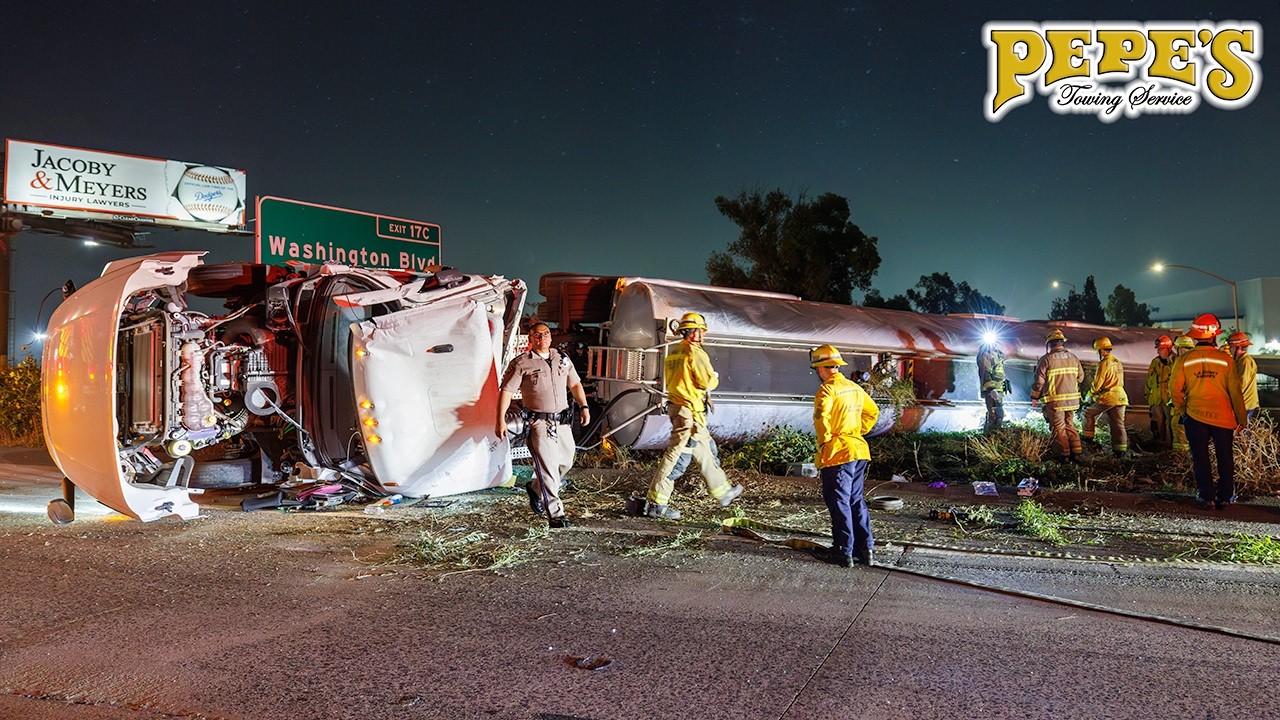 Fuel tanker crashes and rolls over - Hazmat mess on freeway