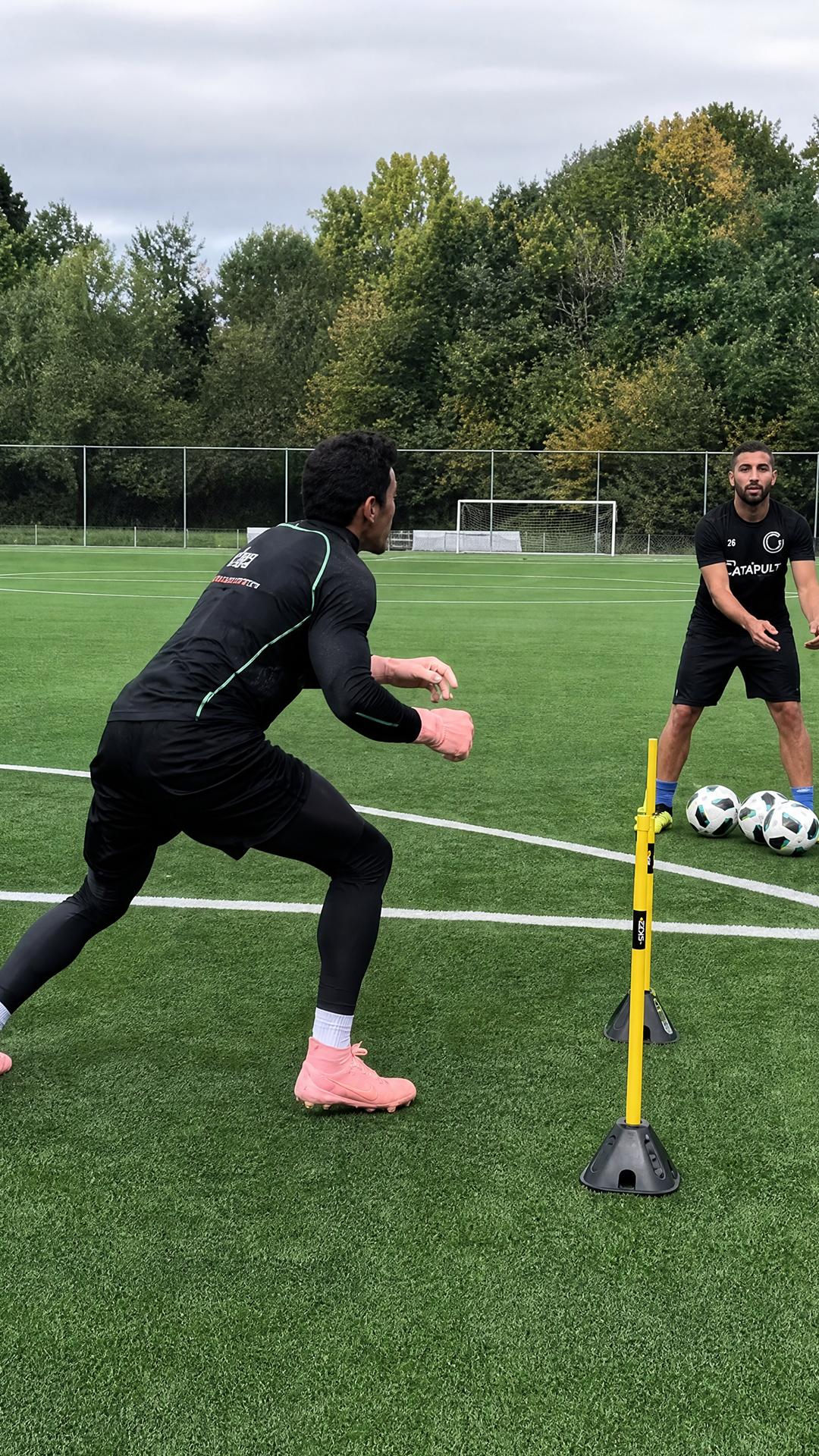 Pro goalkeeper reveals diving skills in football training drill