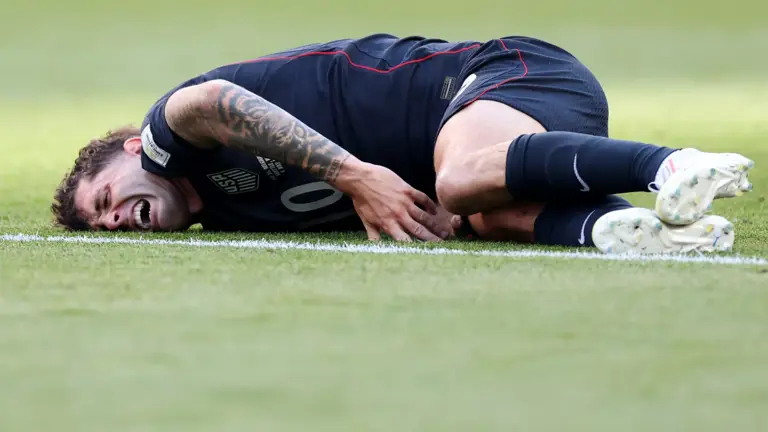 Christian Pulisic #10 of the United States reacts after challenged by Youri Tielemans #8 of Belgium