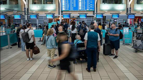 Travellers wait at the check-in at Vancouver International Airport in Richmond, British Columbia (Photograph for representative purpose only)
