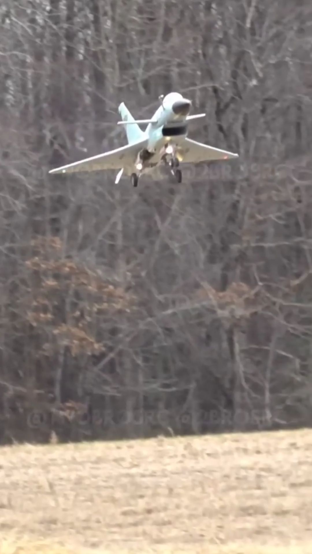 Realistic J-10 model aircraft performs smooth touch and go maneuvers