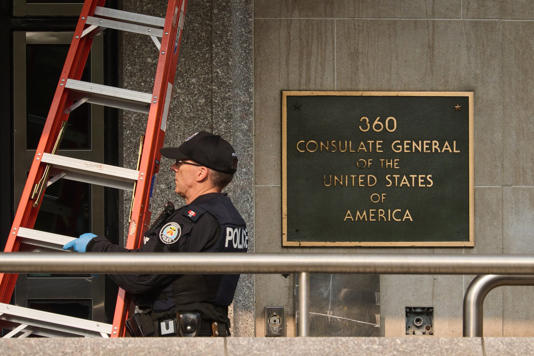 Police work the scene of an early morning shooting outside the US Consulate in Toronto, on Monday, July 27, 2026. THE CANADIAN PRESS/Sammy Kogan