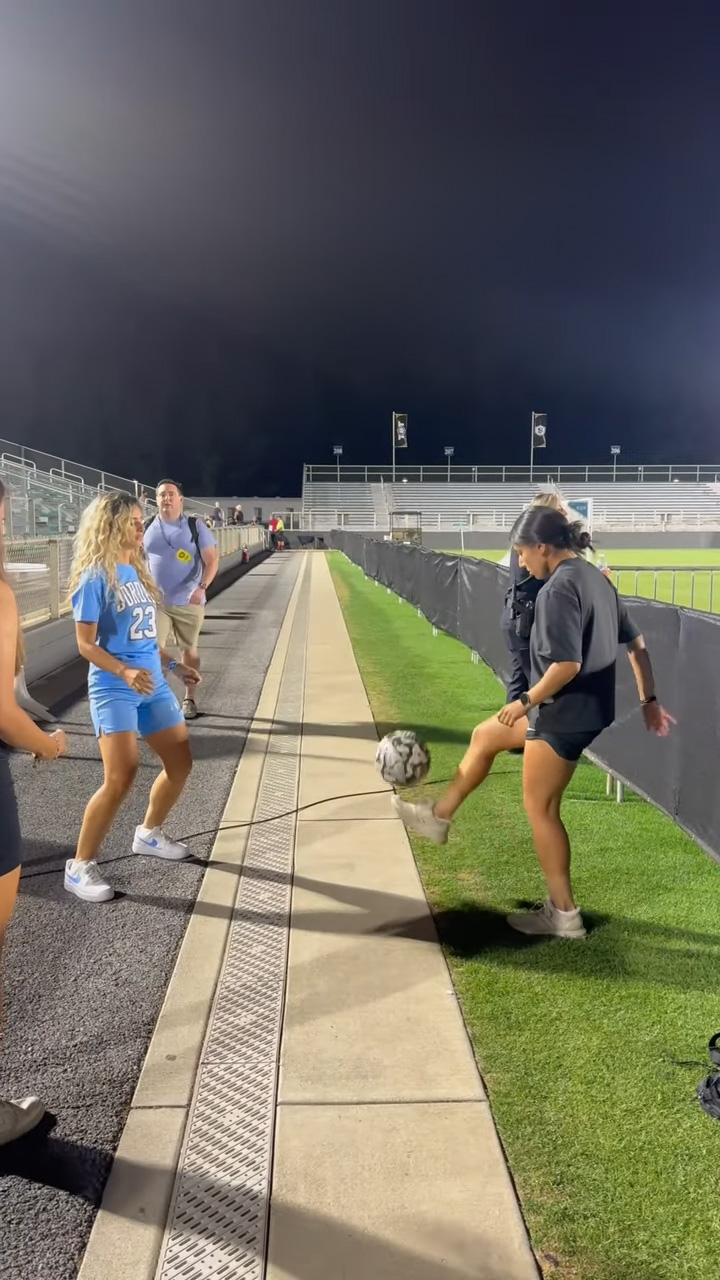 Watch young football freestylers execute seamless ball control techniques