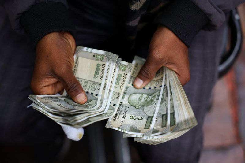 Indian rupee drifts as central bank intervention blunts oil jitters
