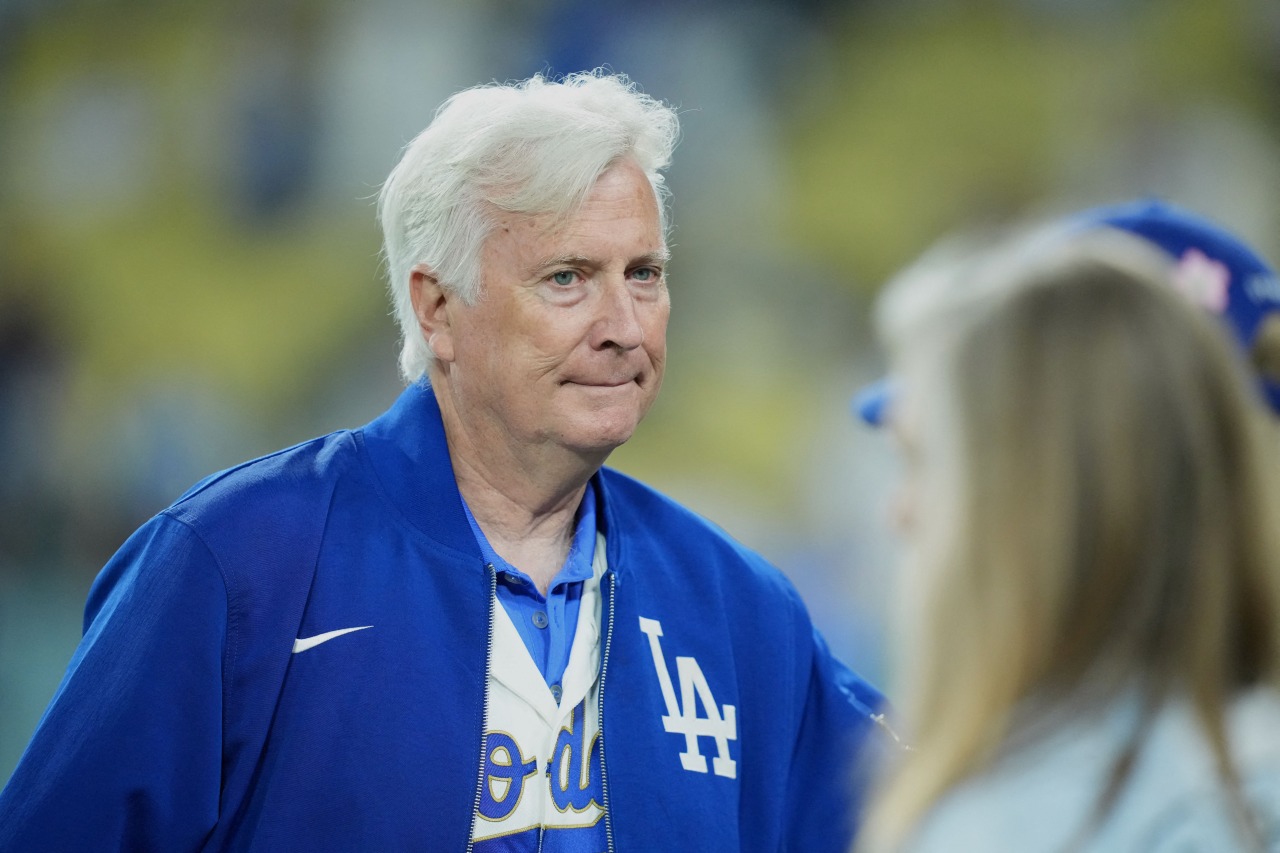 The Lakers' owner needed cash. Then came a $12.5 billion offer to buy the team.