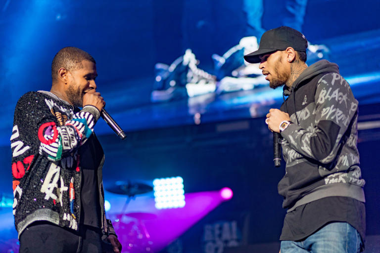 Usher (left) and Chris Brown (right) are currently traveling on their joint R&B tour (Getty)