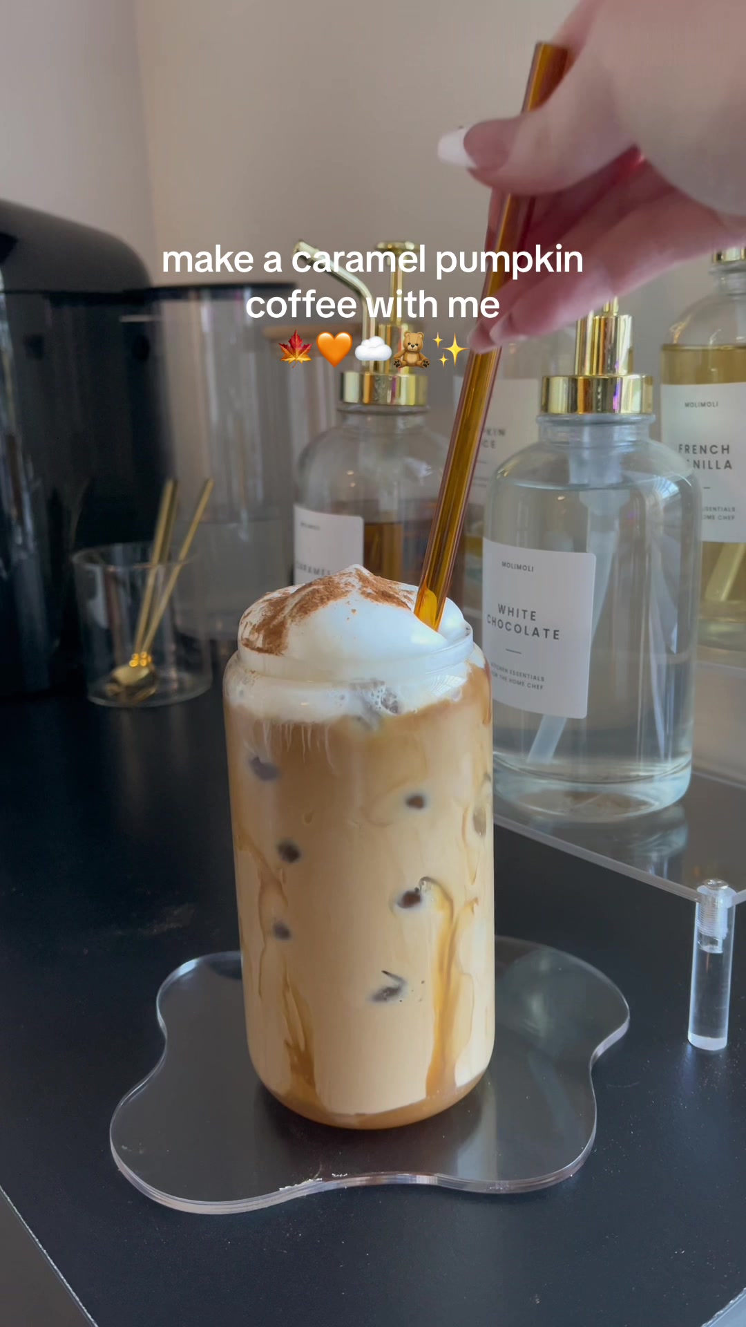 Making a creamy caramel pumpkin iced coffee
