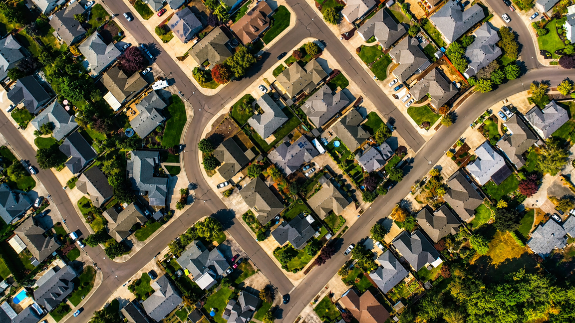 Curving streets shape a quiet residential neighborhood