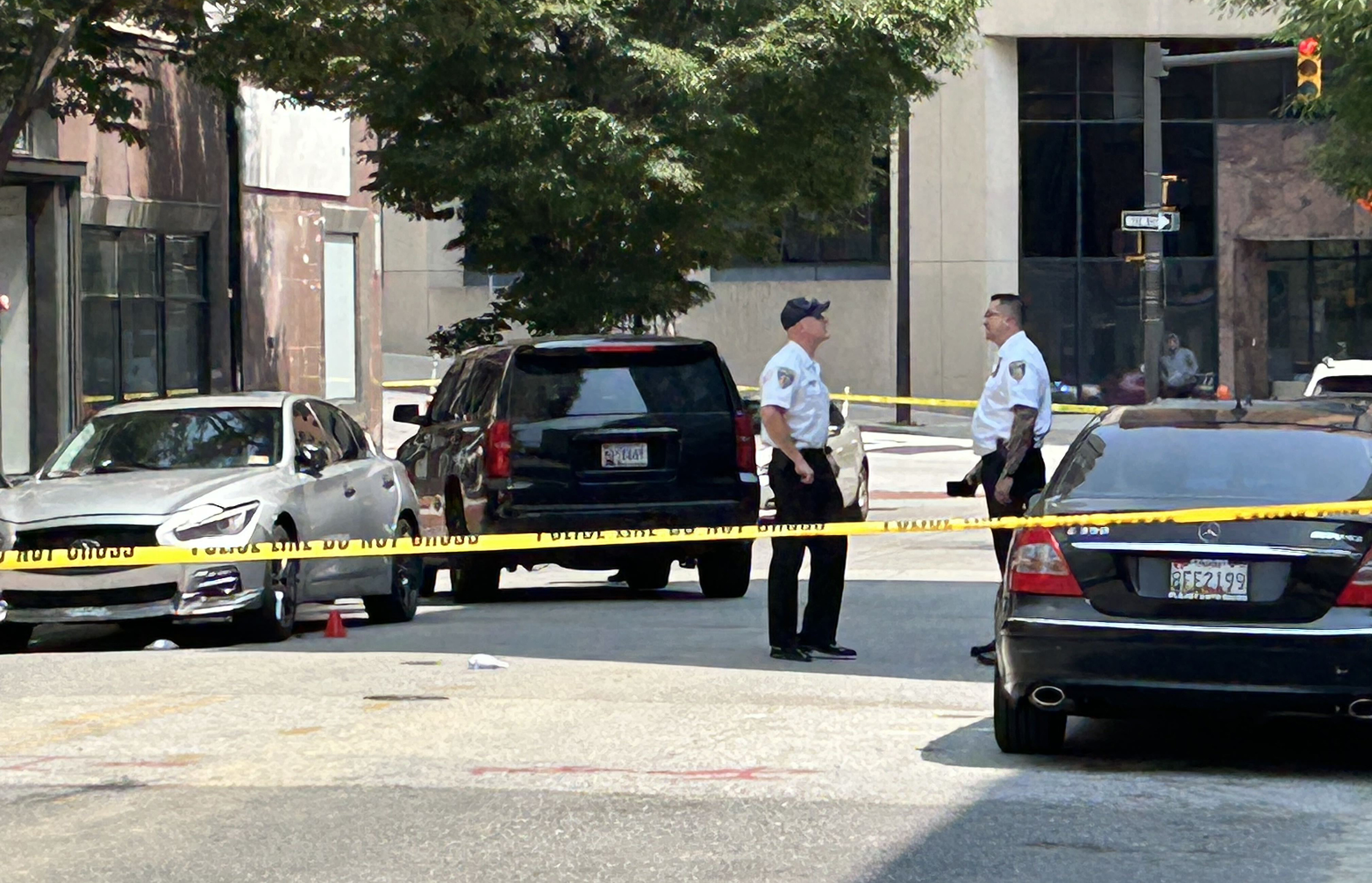 Man flees gunfire, barricades himself in downtown Baltimore building