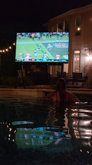 Outdoor poolside TV setup creates the ultimate entertainment space
