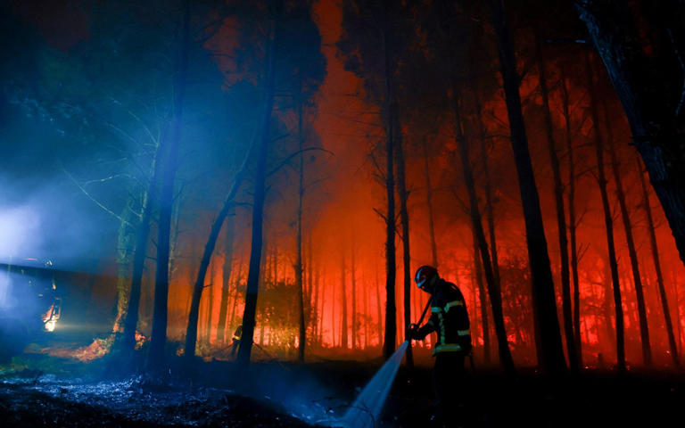 Firefighters battle a wildfires in the Landes forest in Luglon, south-western France - Romain Perrocheau /AFP via Getty Images