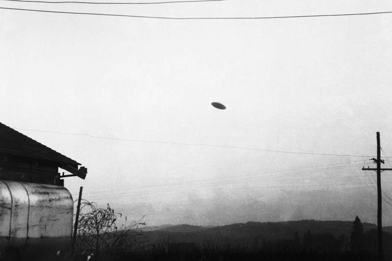 A picture of a flying saucer photographed by farmer Paul Trent shown flying over his farm in McMinnville, Ore., May 11, 1950. (Bettmann Archive/Getty Images)