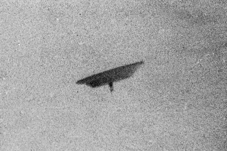 A picture of a flying saucer photographed by farmer Paul Trent shown flying over his farm in McMinnville, Ore., May 11, 1950. (Bettmann Archive/Getty Images)