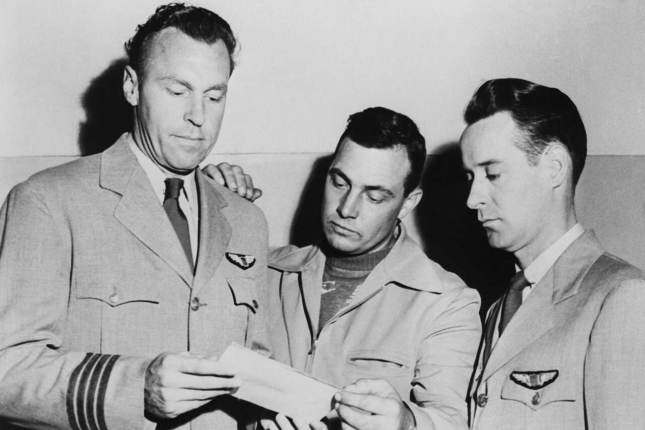 From left, pilots E.J. Smith, Kenneth Arnold and Ralph E. Stevens look at a photo of an unidentified flying object that they sighted while en route to Seattle, Wash., 1947. (Bettmann Archive/Getty Images)