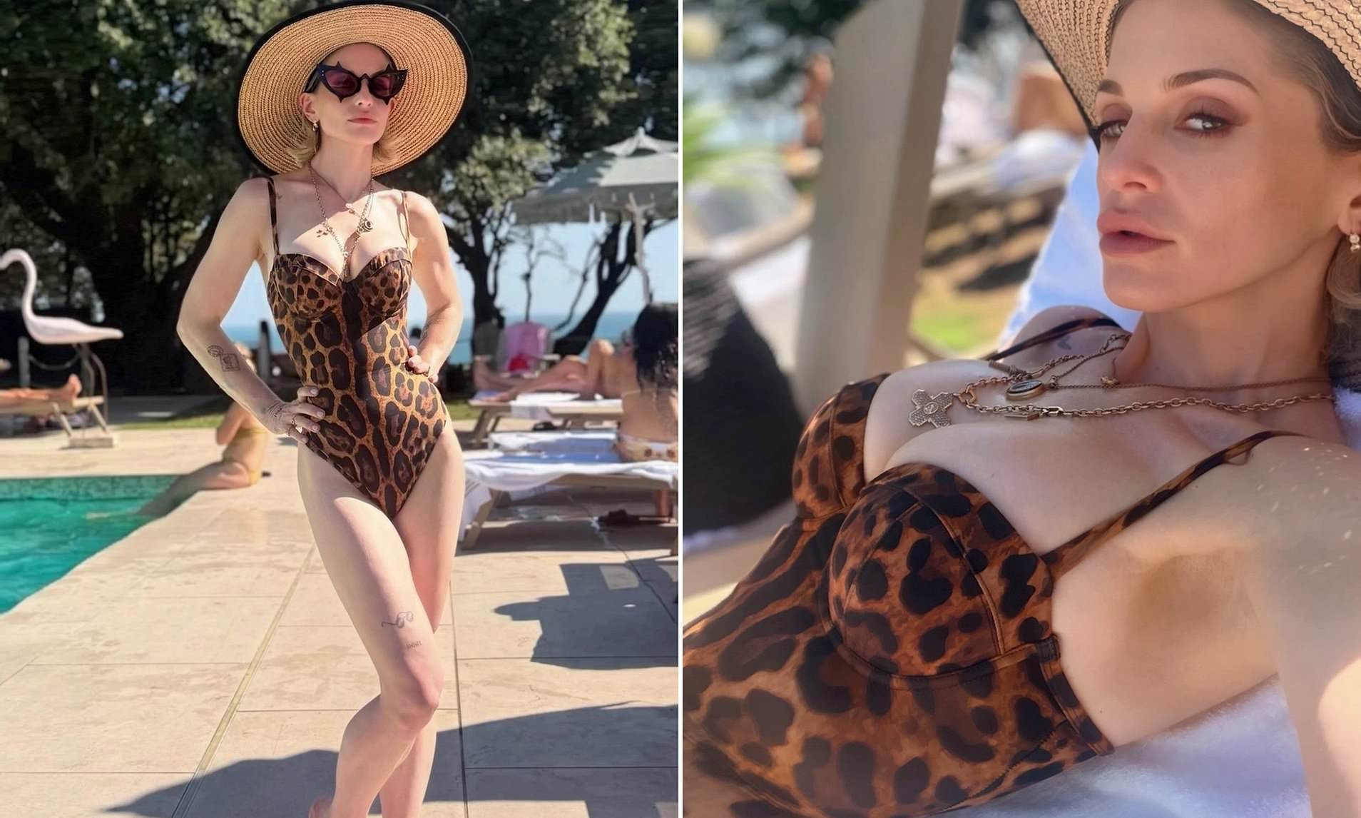 Kelly Osbourne poses in a swimsuit as she starts feud with Twisted Sister frontman Dee Snider