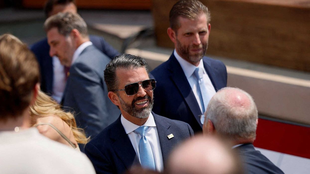FILE PHOTO: U.S. President Donald Trump's sons Eric Trump and Donald Trump Jr. at Burning Hills Amphitheatre on the day of the dedication of the Theodore Roosevelt Presidential Library in Medora, North Dakota, U.S., July 1, 2026. REUTERS/Evan Vucci/File Photo