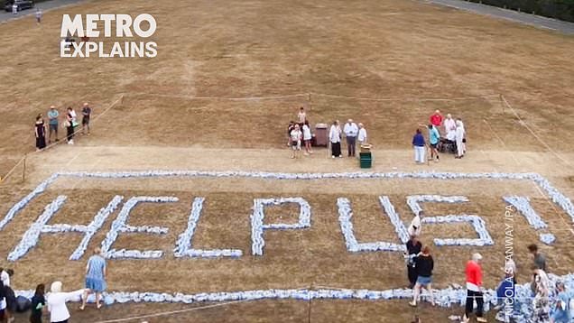 Angry locals spell out 'help us' with plastic bottles after days ...