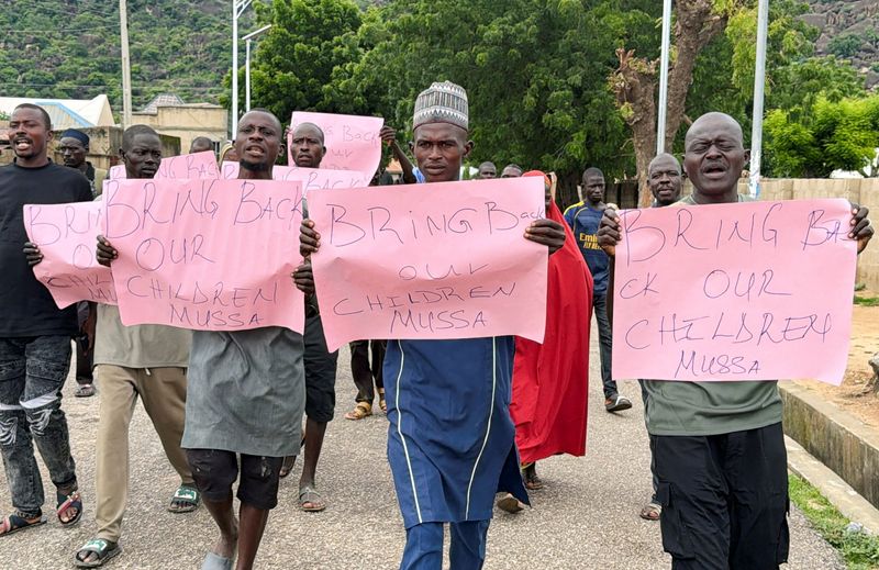 Parents of abducted students hold placards during a protest calling for the release of their children, as students remain in the custody of their captors in Askira-Uba, Borno State, Nigeria, August 20, 2026. Picture taken with a mobile phone. REUTERS/Umaru Kirawa