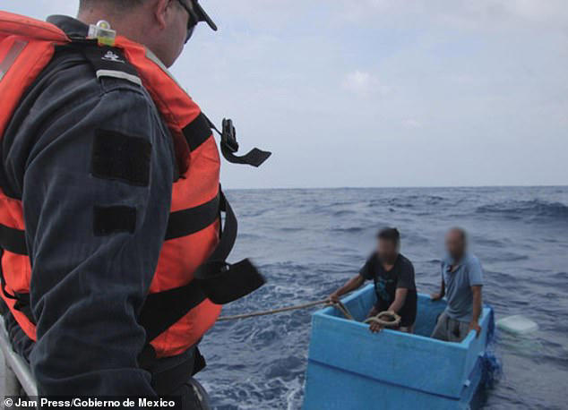 The men were able to survive after climbing into a cool box that was onboard their boat, where they took refuge 
