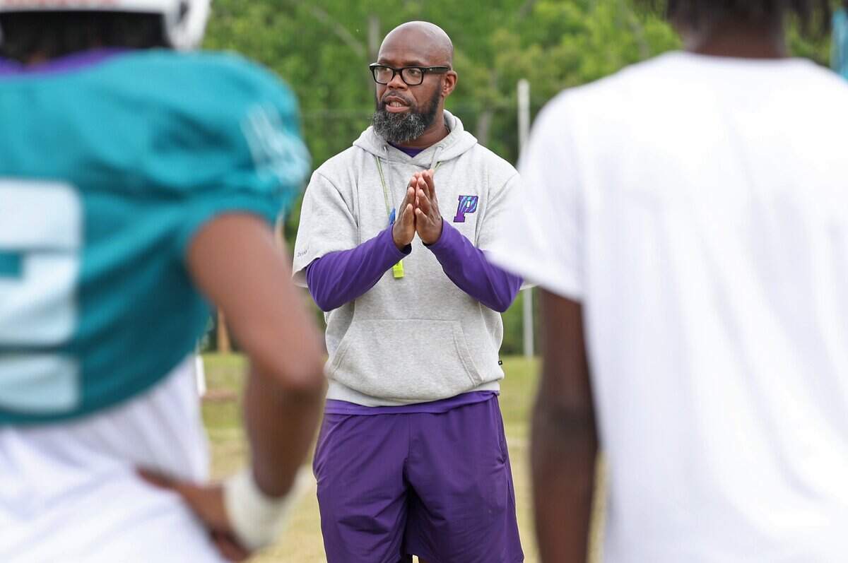 A Charlotte high school football coach has been suspended before start of season