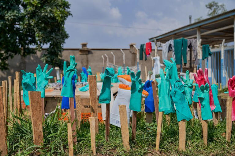 Rubber gloves dry in the sun at the Ebola treatment center of the General Hospital in Bunia, Ituri province