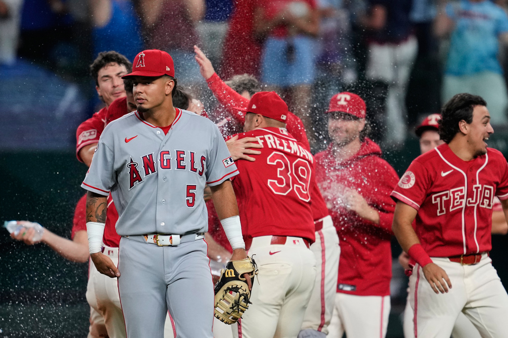 Scoreless through 9, Rangers beat Angels 2-1 as Langford has tying RBI ...